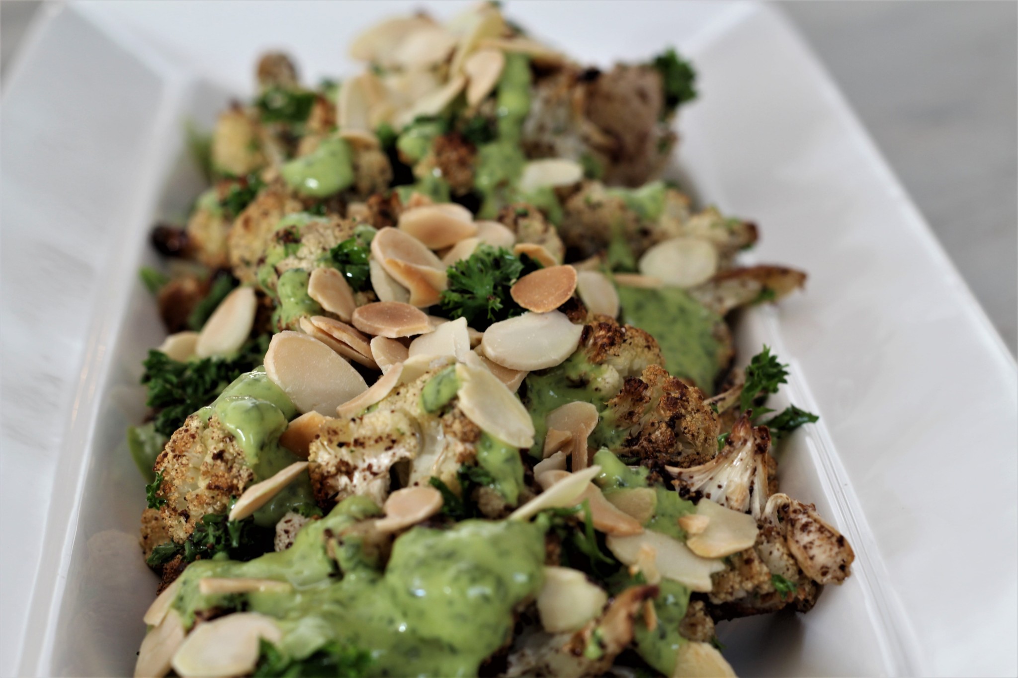 Roasted Cauliflower & Green Tahini Dressing (paleo. vegan. gf. df)